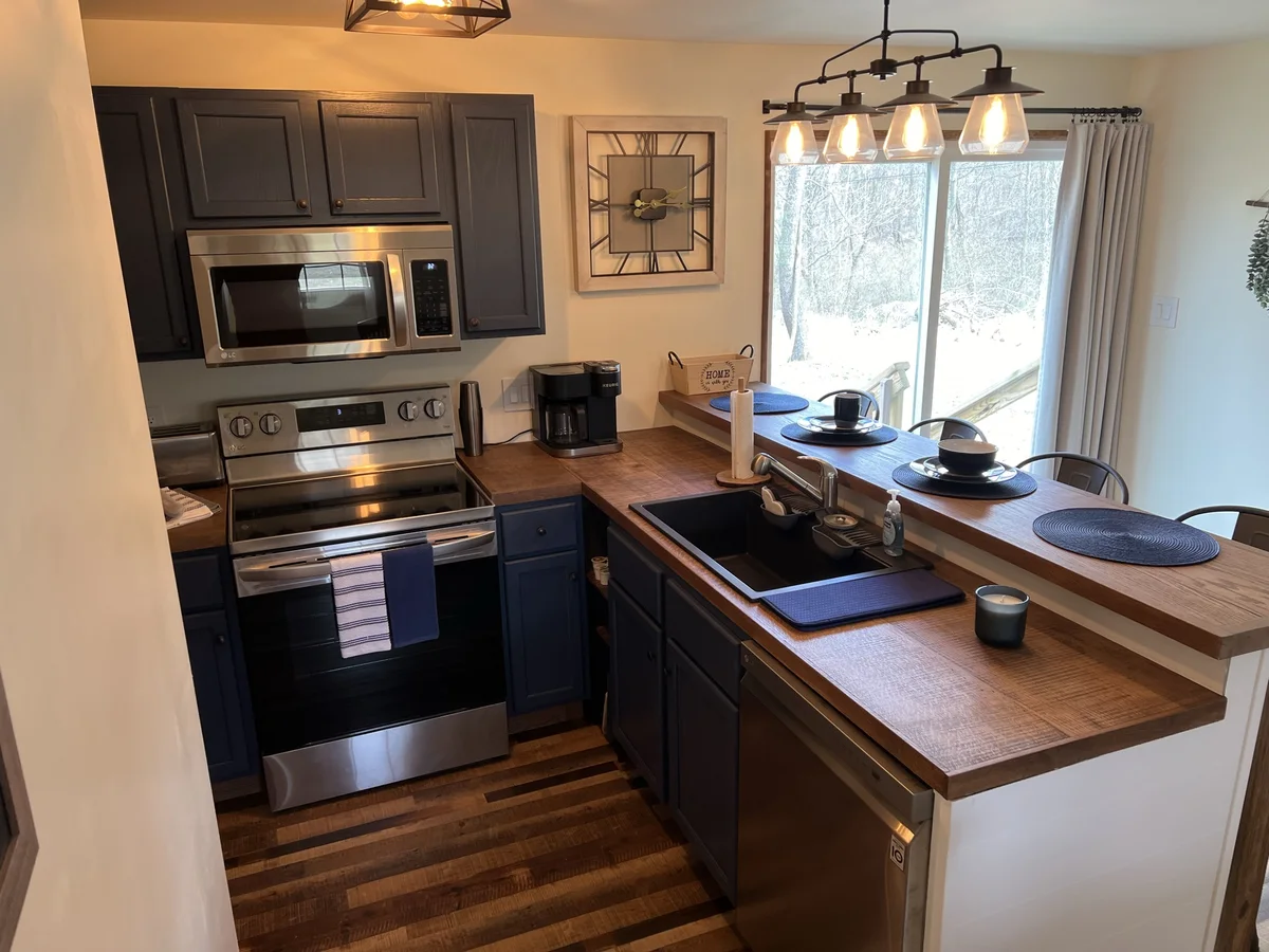 Kitchen at The Piedmont with stainless appliances and counter seating